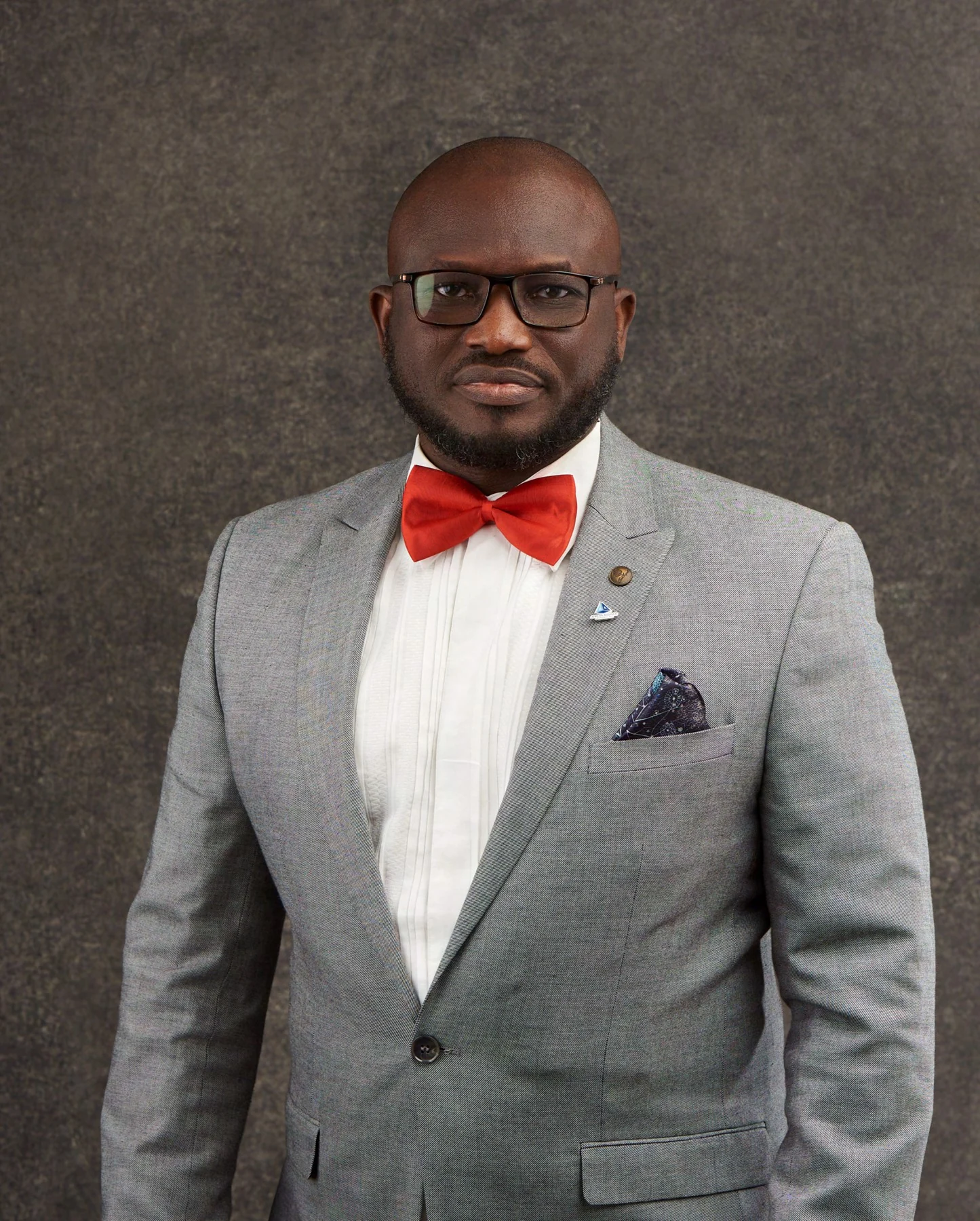 Formal portrait with a red bow tie