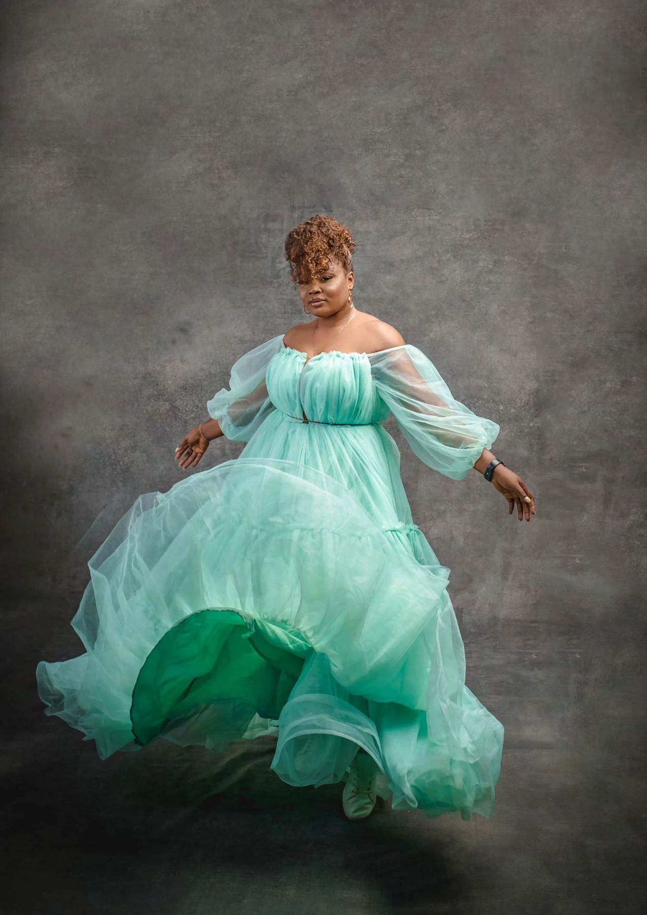 Flowing mint dress studio portrait
