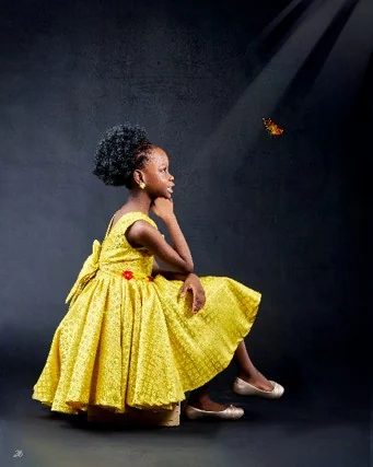 Seated portrait in a yellow dress